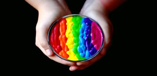 Hands holding rainbow colored paint piqsels.com-id-zkpsl