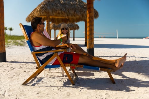 Pink Shell Resort - Couples on the Beach in Lounge Chairs