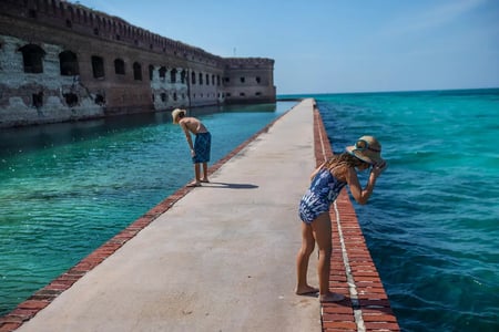 FORT JEFFERSON DRY TORTUGAS NATIONAL PARK CHILDREN WALKING ALONG MOAT Visit Florida