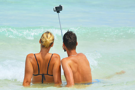 Couple on the Beach with a Camera