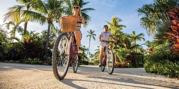 Couple riding bikes in Key West